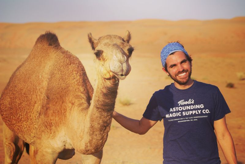 Riding Camels Through the Desert in Oman