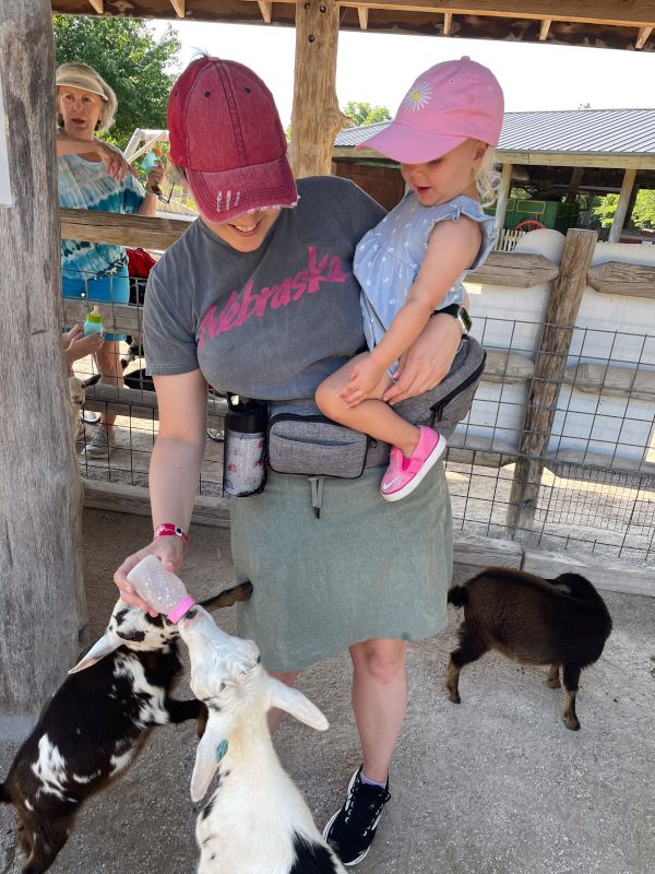 Helping Mommy Give Some Goats Breakfast!
