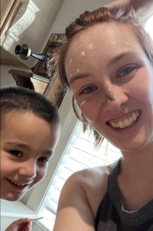 Noa Getting Her Face Painted by Levi