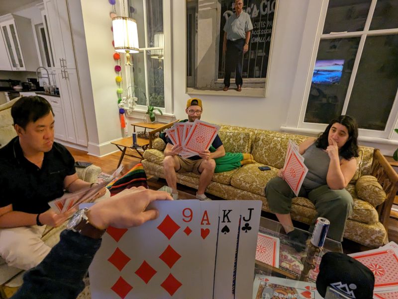 Playing a Game of Euchre with Comically Large Cards