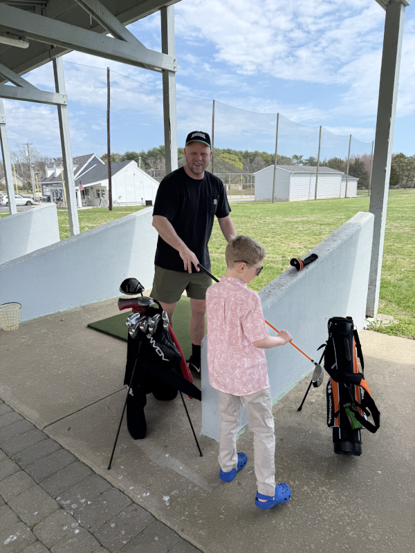 Adam with his Nephew on the Driving Range